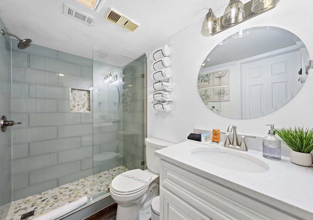 Full bathroom with tiled walk-in shower