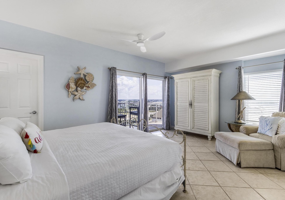 Balcony access with bay views from the king guest bedroom