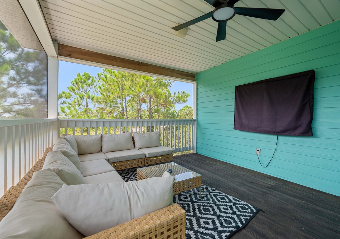 Main floor deck with sectional sofa and outdoor TV