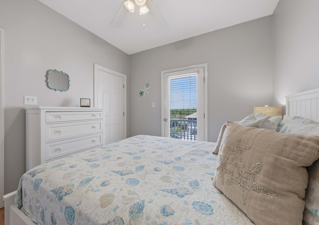 Top floor guest bedroom with queen bed