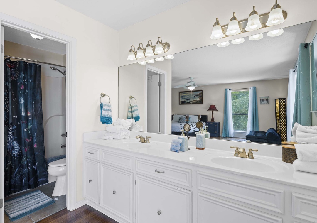 Primary ensuite bathroom with dual vanities