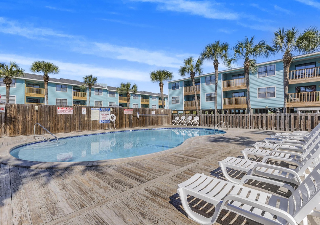 Community pool with lounge chairs