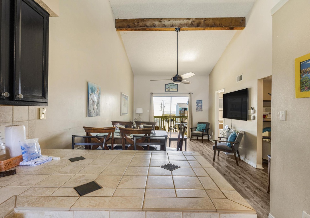 View from the kitchen into the living and dining areas