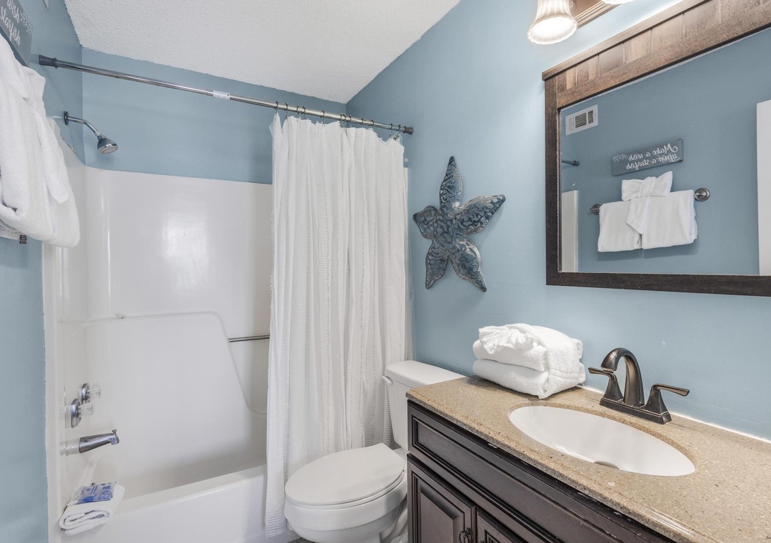 Primary bathroom with tub and shower