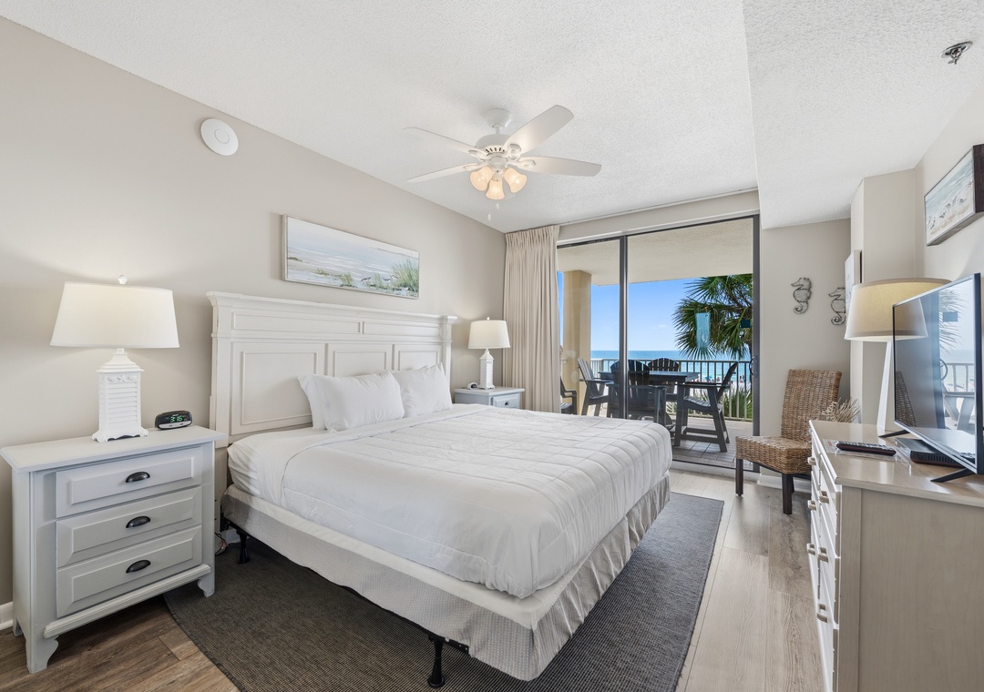 Primary bedroom with balcony access