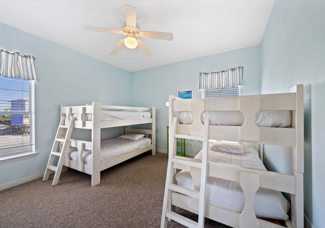 Guest bedroom 3 features two twin-over-twin bunk beds