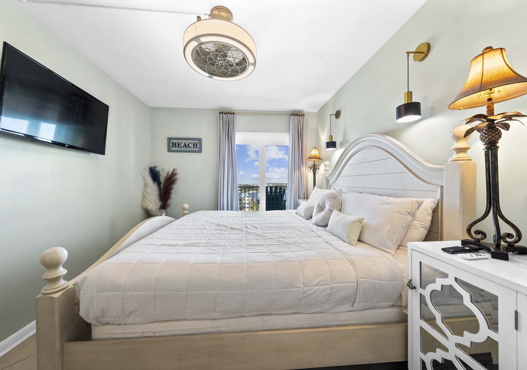 Primary bedroom with balcony access