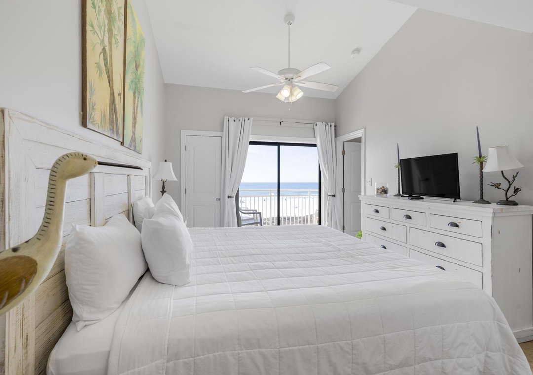 Primary bedroom with balcony access