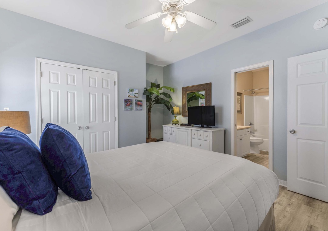 Primary bedroom with queen bed and ensuite bathroom