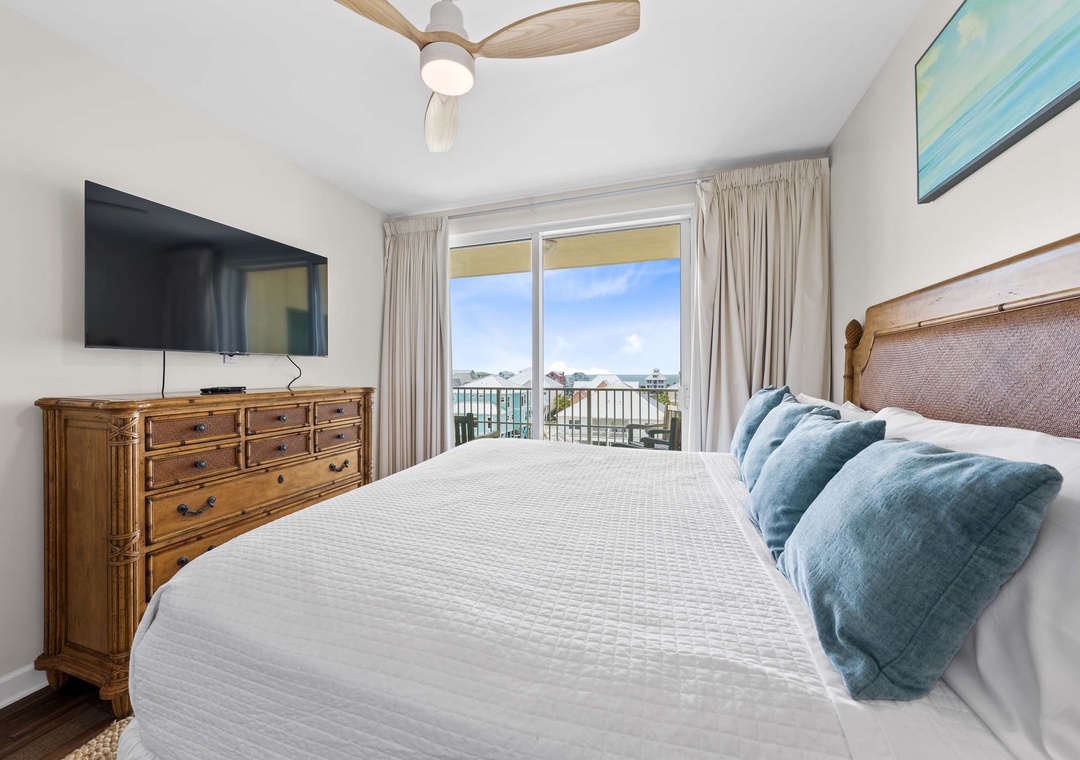 King primary bedroom with balcony access