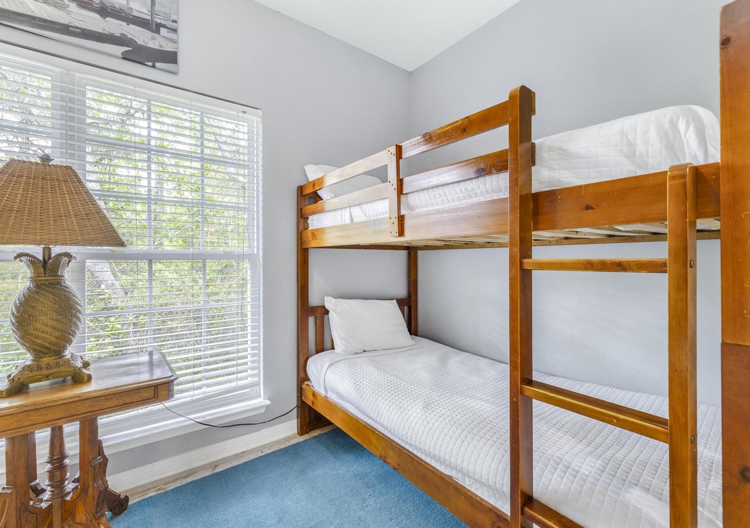 Two twin-over-twin bunk beds in the second guest bedroom