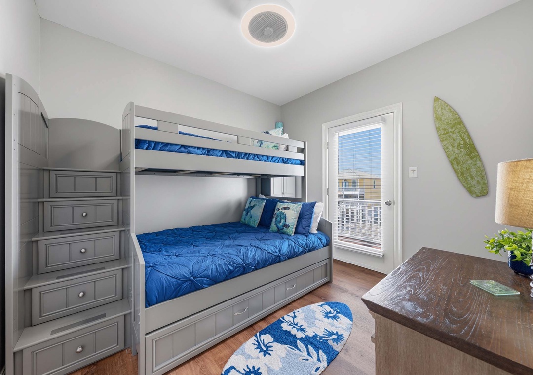 Top floor bunk bedroom with twin over full bunk bed