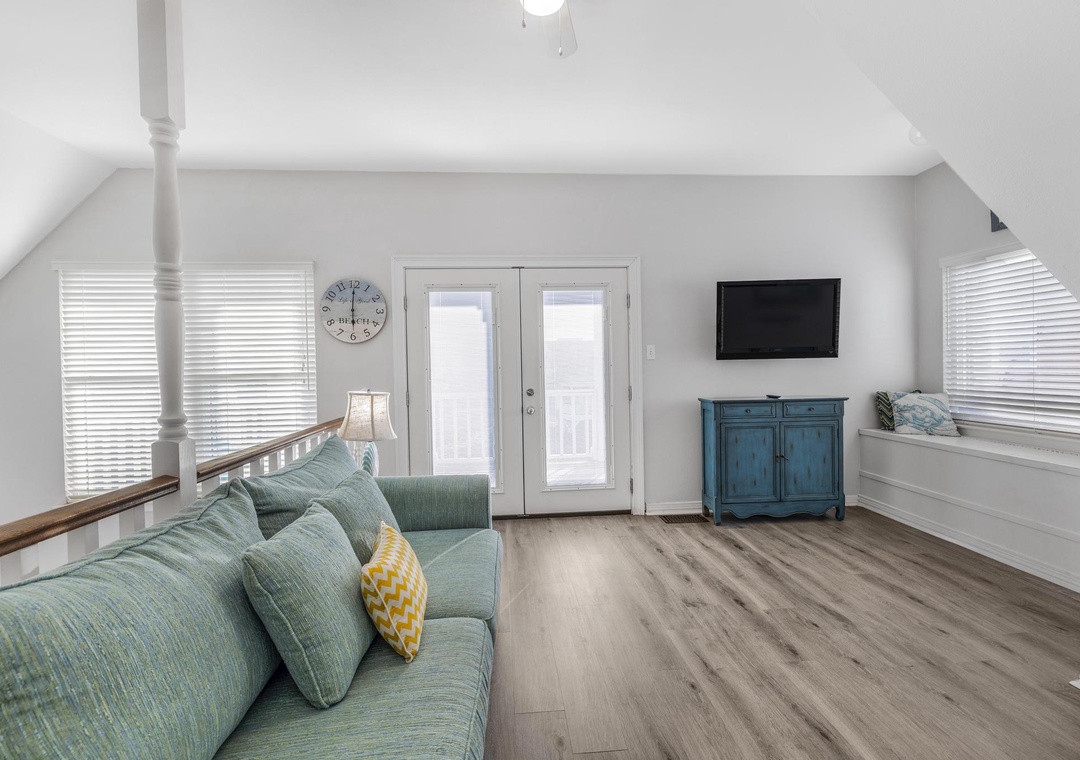 Second floor living area with balcony