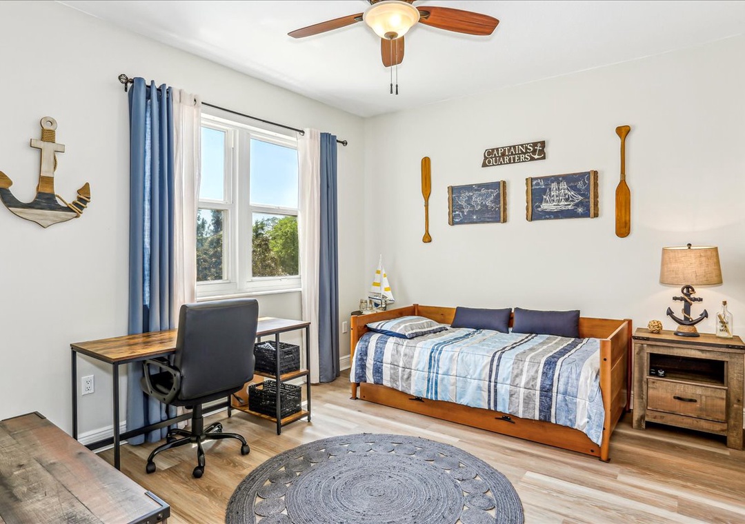 Guest bedroom 2 with twin daybed + trundle and dedicated workspace