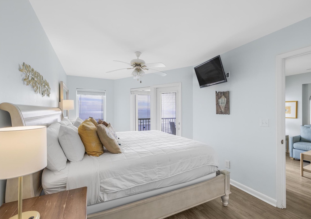 Primary bedroom with balcony access