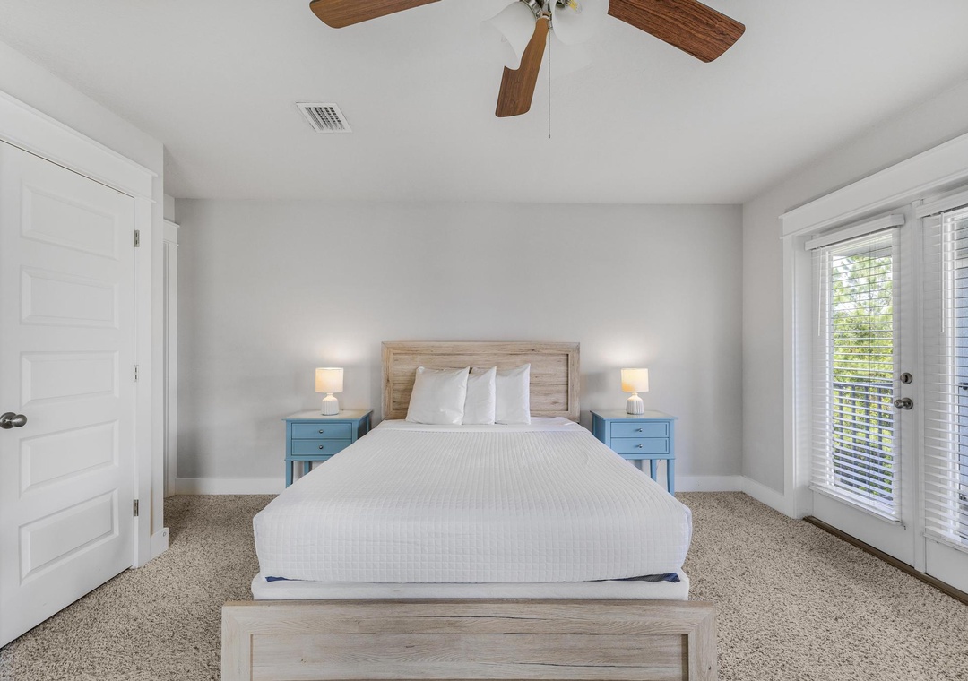 Queen guest bedroom on the third floor with private balcony