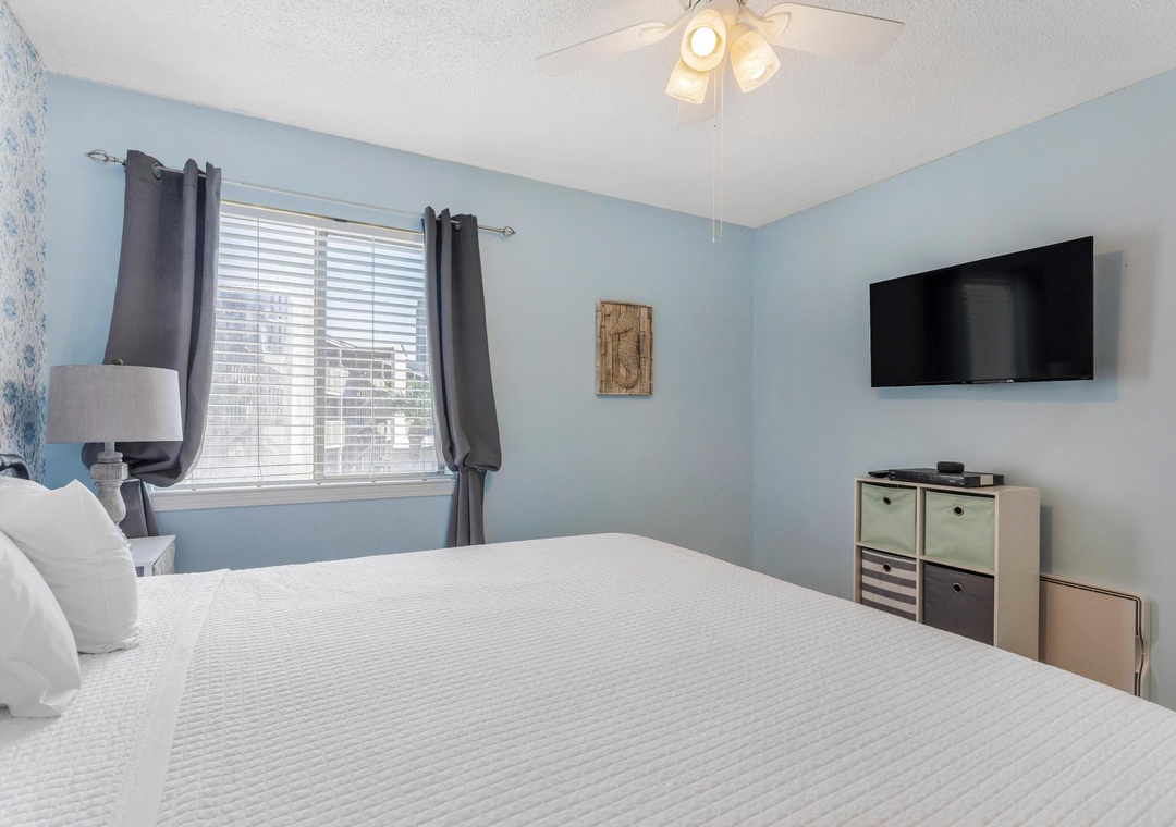 Primary bedroom with flat-screen TV