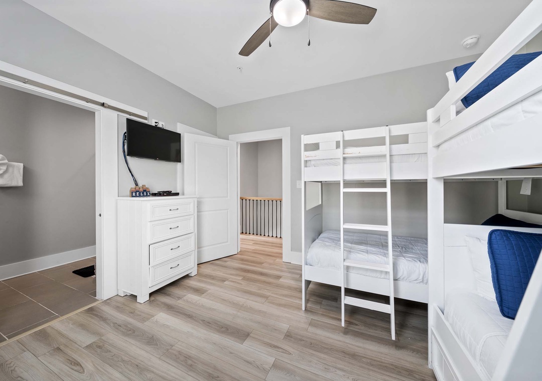 Guest bedroom 1 with two twin-over-twin bunks and a twin trundle