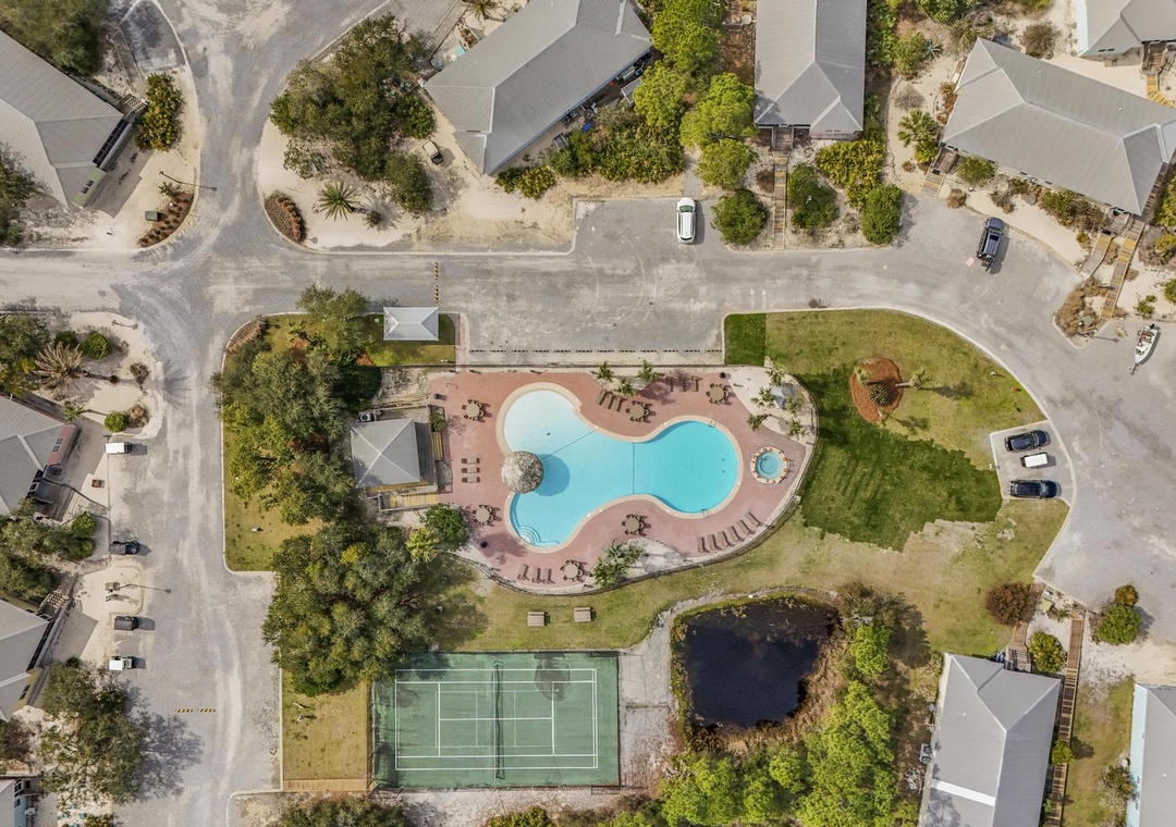 Aerial view of the pool and tennis court