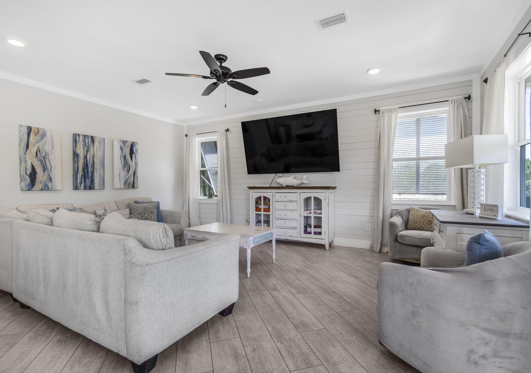 Spacious living room with large flat-screen TV