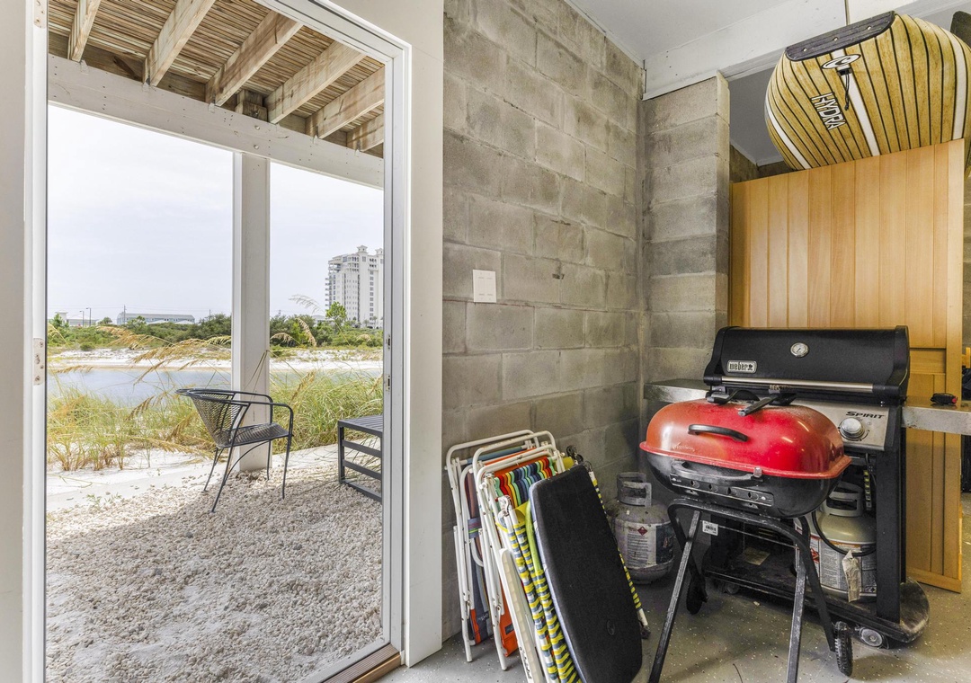 Charcoal grill and beach chairs