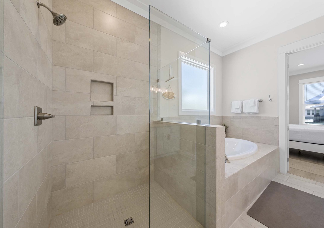 Walk-in shower in the primary ensuite bathroom