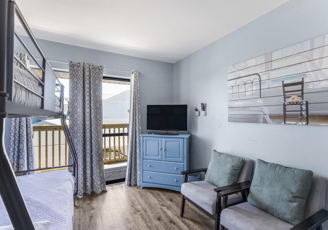 Bunk room with sitting area and TV