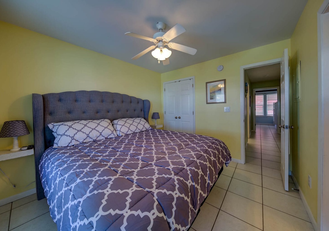 Main bedroom featuring a king-size bed.
