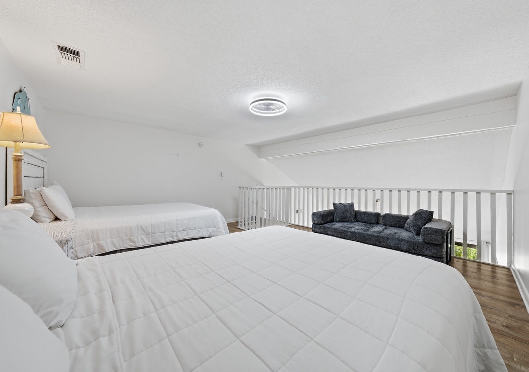 Loft area with two double beds