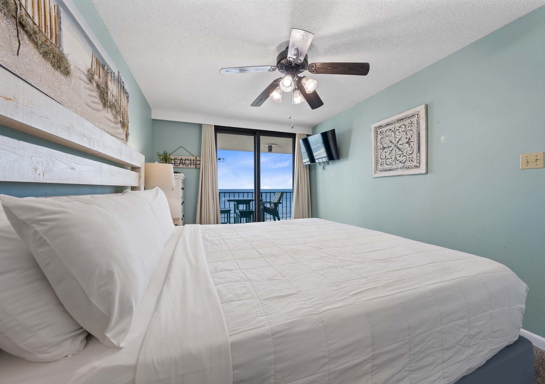 Primary bedroom with balcony access