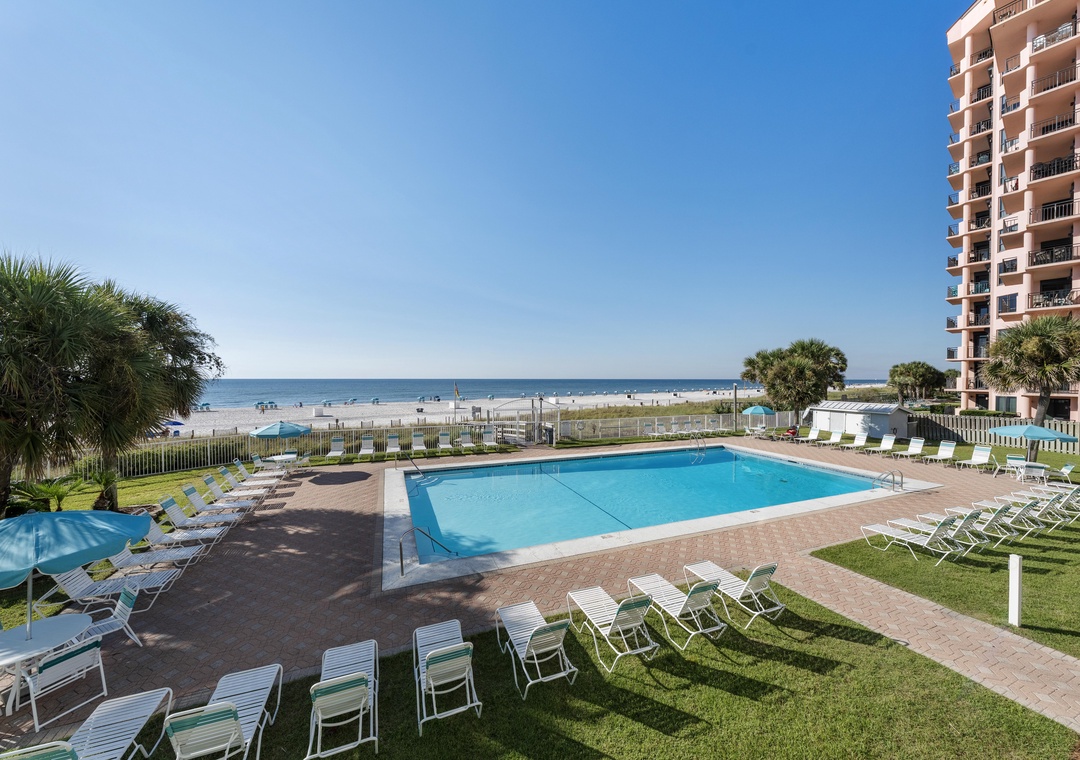 Pool deck and lawn near the beach