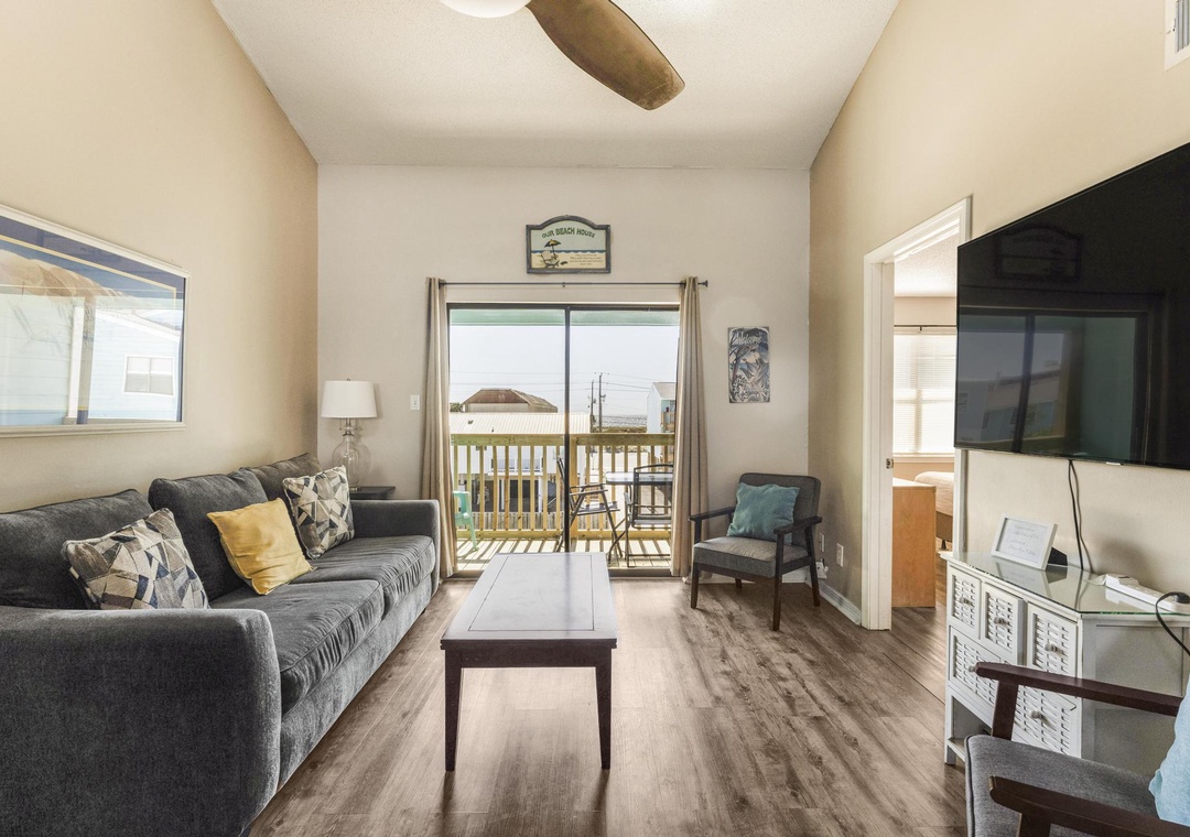 Comfortable living room with a large flat-screen TV