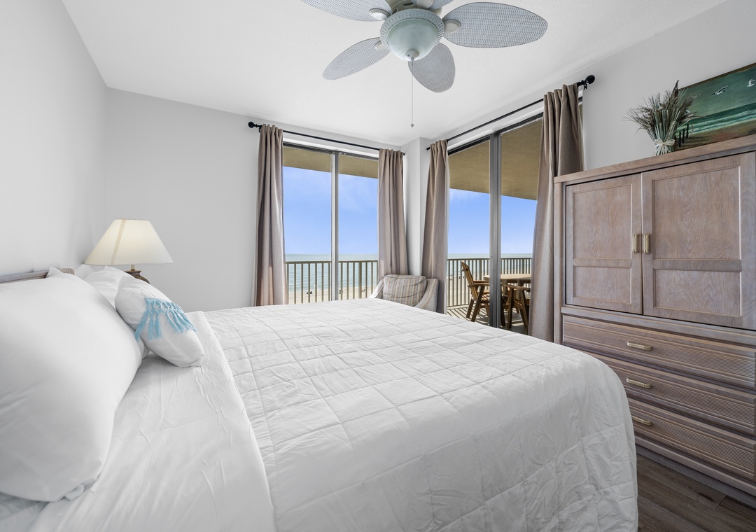 Primary bedroom with balcony access