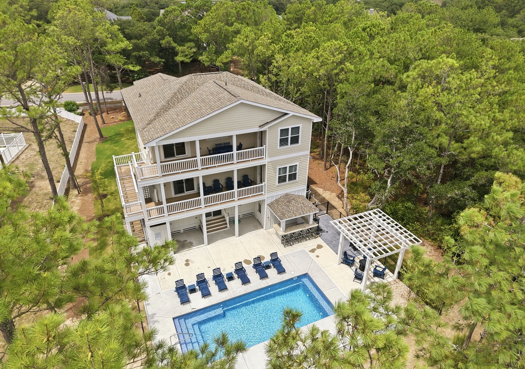 CC136: Breezy Does It | Back Exterior with Pool, Hot Tub and Tiki Bar
