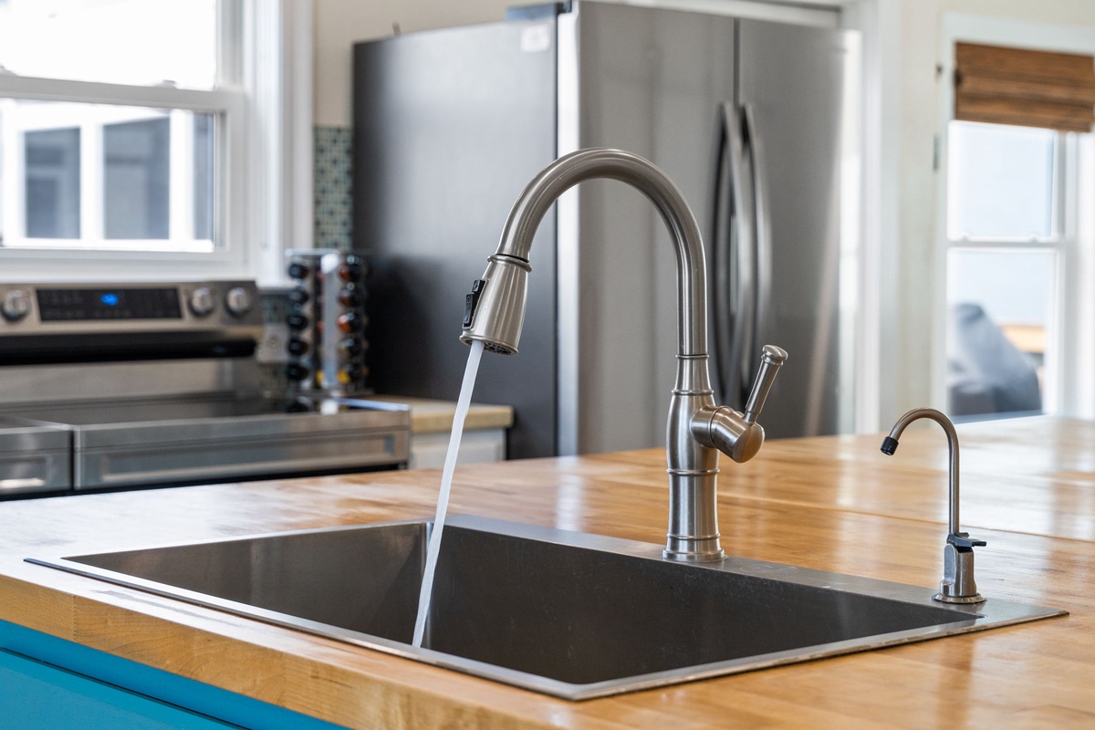 Your fully-equipped kitchen features stainless steel appliances, a stylish pulldown faucet, and beautiful butcher block countertops—perfect for preparing meals during your stay.