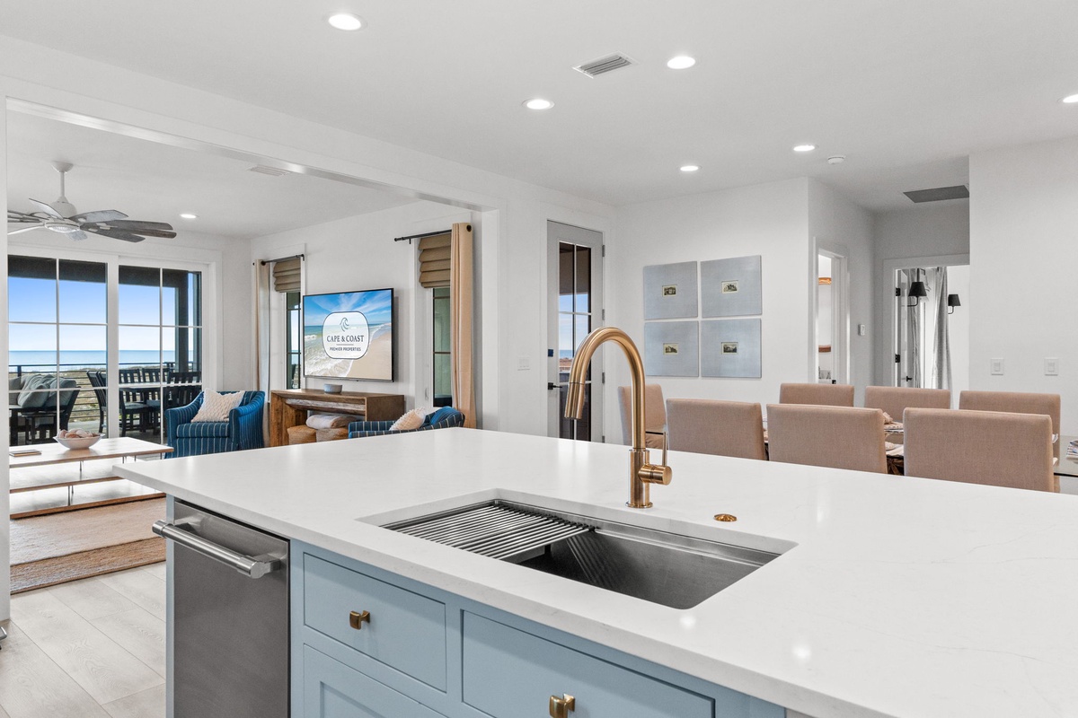 Cook with ocean views in your modern kitchen, featuring quartz countertops and copper fixtures that gleam in the coastal light.