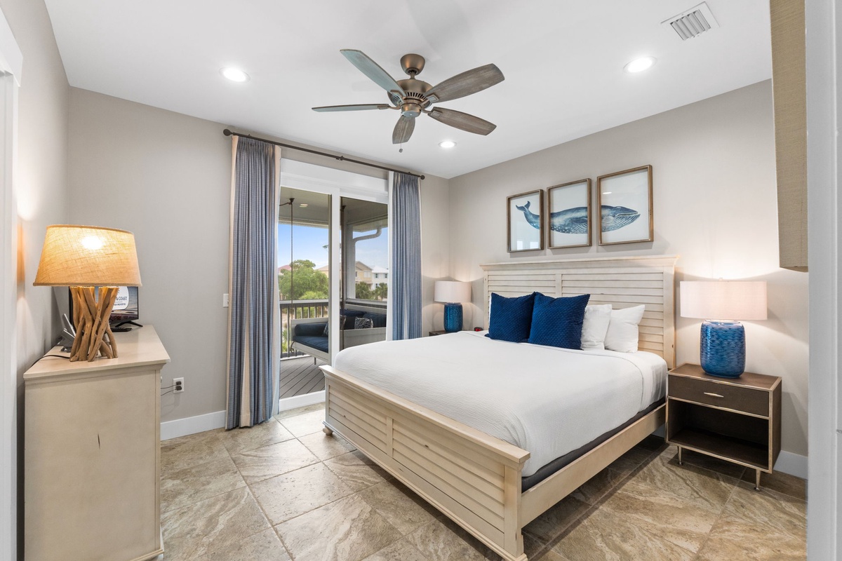 Unwind in your private retreat with coastal decor, a ceiling fan for comfort, and balcony access to enjoy mountain views. Soft lighting and a plush bed invite relaxation after a day of adventure.