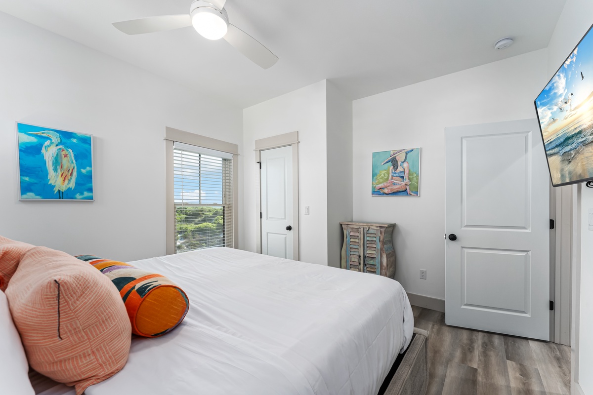 Drift off in your bright coastal bedroom with ocean-inspired art, comfy pillows, and peaceful views through your window.