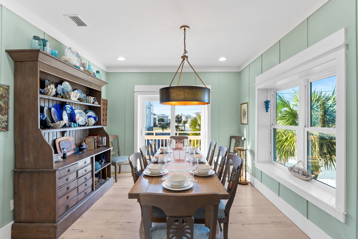 Gather around your coastal dining table with palm views, surrounded by charming nautical decor and plenty of space for memorable meals.