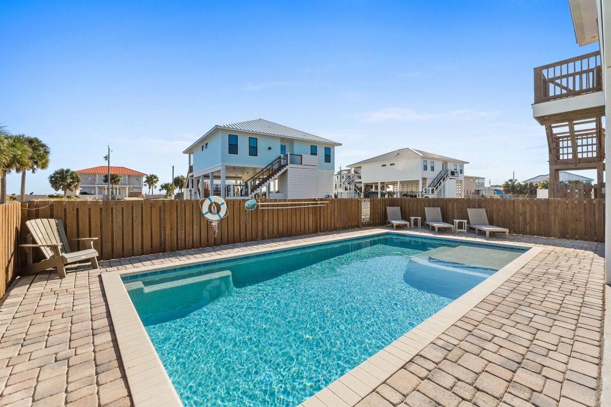 Your private pool oasis awaits with sparkling blue waters, comfortable loungers, and peaceful surroundings for ultimate relaxation.