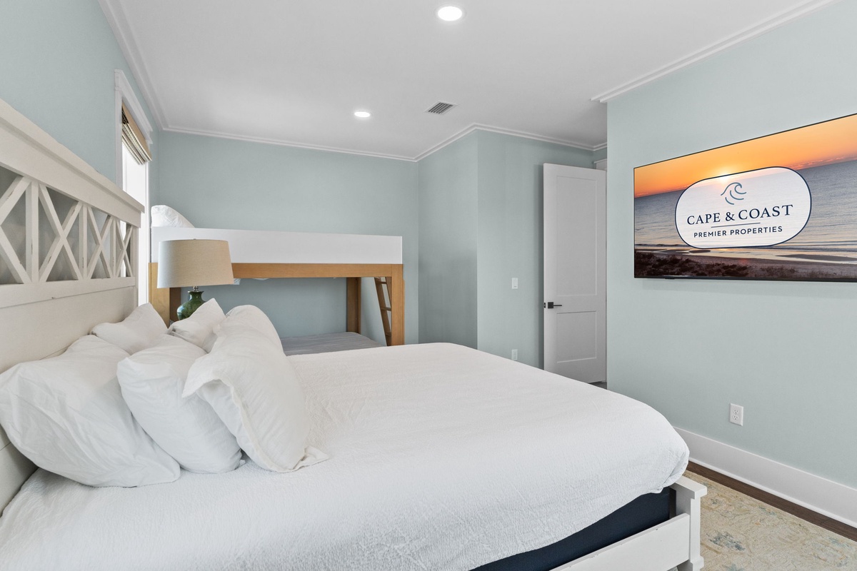 Rest easy in your serene bedroom, where calming coastal colors and thoughtful design create a peaceful retreat after a day of adventure.
