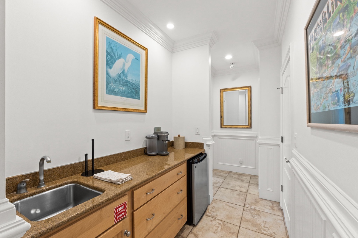 Your kitchenette awaits with a sink, mini-fridge, and coffee maker—everything you need for light prep and refreshments during your stay.