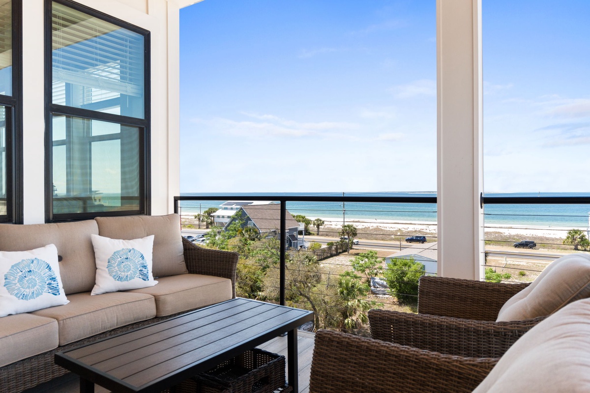 Relax on your private terrace with stunning ocean views and comfortable outdoor furniture - the perfect spot to unwind.
