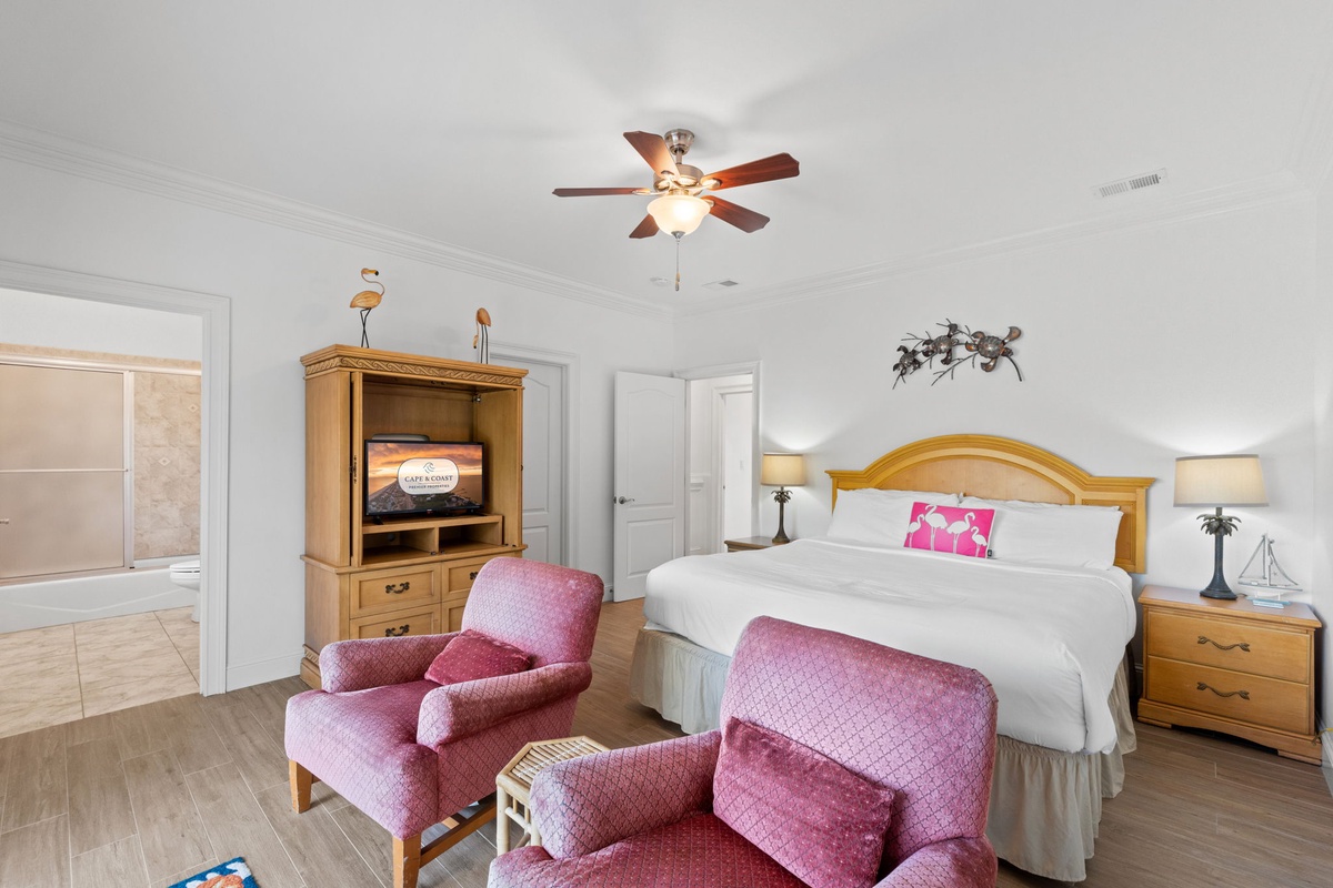 Unwind in your spacious bedroom with plush bedding, cozy seating, and entertainment at your fingertips. Wake to soft light and gentle breezes from your ceiling fan.