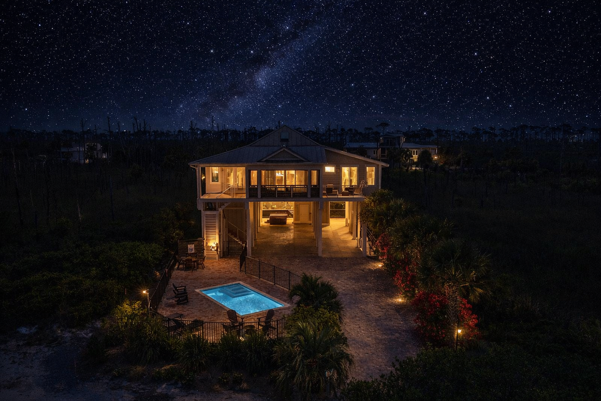 Starlit coastal retreat at night