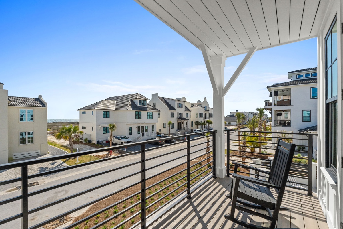Step onto your private balcony and settle into comfortable seating while taking in panoramic neighborhood views.