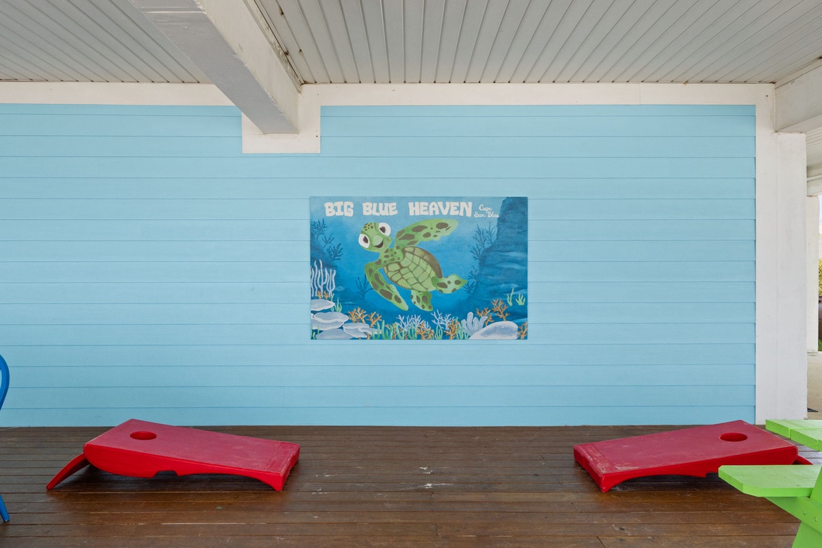 Colorful mural and fun play boards create a cheerful outdoor spot perfect for kids to enjoy during your stay.