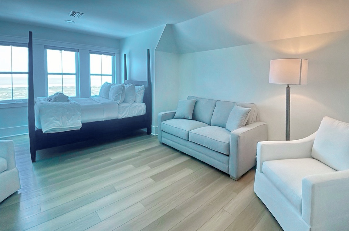 Wake up to stunning sea views framing your plush king bed, then unwind on your private sofa while gentle ocean breezes drift through your windows.