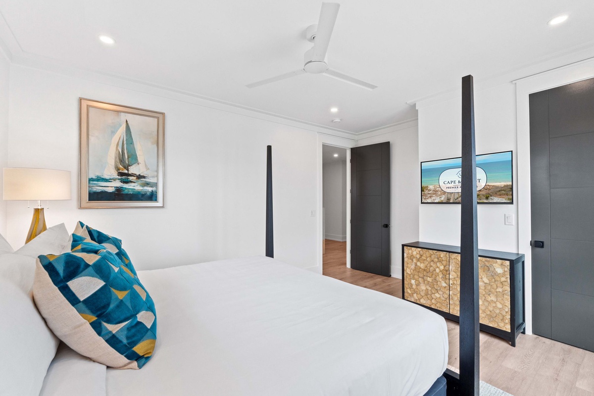 Wake up refreshed in this bright, coastal-inspired bedroom with crisp linens, nautical artwork, and modern accents that create your perfect beachside retreat.