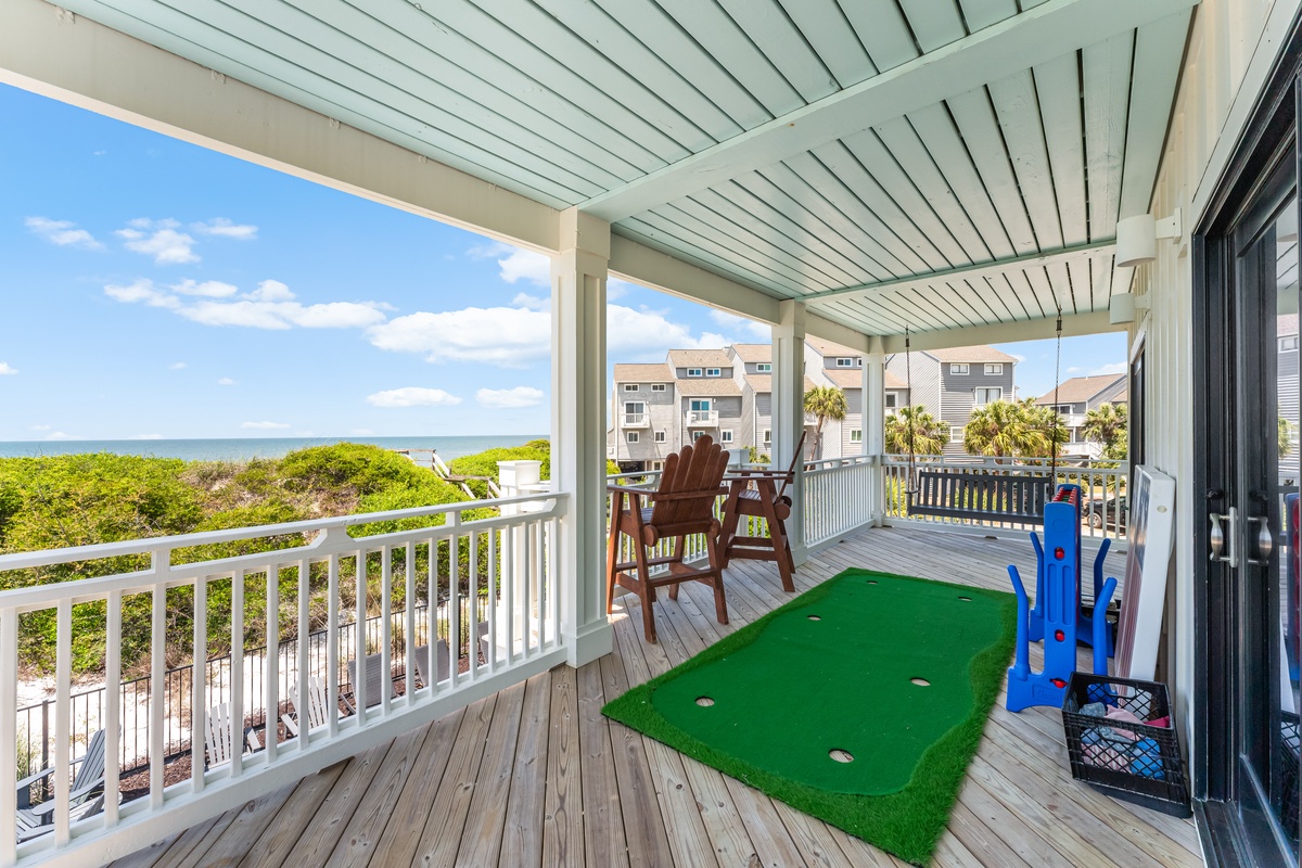 Your private deck offers stunning sea views while you perfect your putting on the mini golf setup.